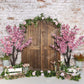 Kate春の桃の花の木製のドアのレンガの壁の背景Emetselch設計