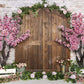 Kate春の桃の花の木製のドアのレンガの壁の背景Emetselch設計